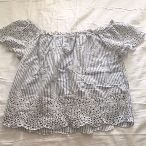 blue and white off the shoulder shirt.